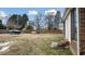 Large backyard with shed, boat, and partially snow covered grass at 927 Bellvue St, Burlington, NC 27217