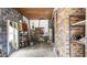 Unfinished basement with storage shelving and water heater at 927 Bellvue St, Burlington, NC 27217