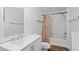 Clean bathroom with tub, shower, and vanity, simple yet functional at 927 Bellvue St, Burlington, NC 27217