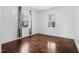 Bright bedroom with hardwood floors and two windows, offering natural light at 927 Bellvue St, Burlington, NC 27217