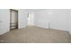 Simple bedroom with carpet, closet, and access to laundry at 927 Bellvue St, Burlington, NC 27217