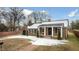 Brick ranch house with a covered porch and snowy yard at 927 Bellvue St, Burlington, NC 27217