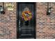 Black front door with a fall-themed wreath, welcoming entrance at 927 Bellvue St, Burlington, NC 27217
