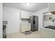 Bright kitchen with white cabinets, stainless steel appliances and tile floor at 927 Bellvue St, Burlington, NC 27217