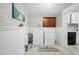 Laundry room with washer, dryer, and cabinets, functional and bright at 927 Bellvue St, Burlington, NC 27217