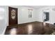 Living room with hardwood floors and view of the front door at 927 Bellvue St, Burlington, NC 27217