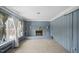Living room with built-in shelving, fireplace and carpet at 927 Bellvue St, Burlington, NC 27217