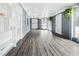 Sunroom with gray walls, wood-look floors, and built-in shelves at 927 Bellvue St, Burlington, NC 27217