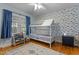 bedroom with playful fish wallpaper and built-in bookcases at 100 Forestwood Dr, Durham, NC 27707