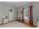 Inviting bedroom with hardwood floors, rug, and natural lighting at 100 Forestwood Dr, Durham, NC 27707