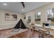 Cozy living room with hardwood floors, large windows and an airy feel at 100 Forestwood Dr, Durham, NC 27707