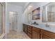 Double vanity bathroom with modern cabinetry and a large mirror at 1015 Epiphany Rd, Morrisville, NC 27560