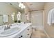 Bright bathroom boasts a double sink vanity and tub-shower combo at 103 Sandy Hook Way, Cary, NC 27513