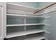 Walk-in closet with custom shelving and ample hanging space at 103 Sandy Hook Way, Cary, NC 27513