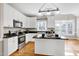 Modern kitchen with granite countertops and stainless steel appliances at 103 Sandy Hook Way, Cary, NC 27513