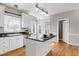 Open kitchen design with an island and a view to the breakfast nook at 103 Sandy Hook Way, Cary, NC 27513