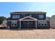 Back exterior view of a two-story home with a covered screened-in porch at 1104 Opal Ln # 104, Durham, NC 27705