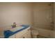 Clean bathroom featuring a vanity with modern hardware, toilet, and tub with shower at 1104 Opal Ln # 104, Durham, NC 27705