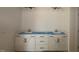 Bathroom vanity featuring double sinks, white cabinets and black hardware at 1104 Opal Ln # 104, Durham, NC 27705