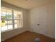 Bright bedroom featuring neutral walls, carpeted floors, and windows providing ample natural light at 1104 Opal Ln # 104, Durham, NC 27705