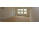 Bedroom featuring bright windows and neutral walls ready for personalization at 1104 Opal Ln # 104, Durham, NC 27705