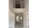 Bright hallway with an open, airy feel, wrought iron railing, and views into other rooms at 1104 Opal Ln # 104, Durham, NC 27705