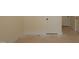 Hallway view with neutral walls and base trim with multiple entrances at 1104 Opal Ln # 104, Durham, NC 27705