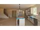 Unfinished kitchen with white cabinets and a large island ready to be finished at 1104 Opal Ln # 104, Durham, NC 27705