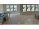Spacious living room bathed in natural light, featuring large windows offering outdoor views at 1104 Opal Ln # 104, Durham, NC 27705