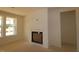 Bright living room featuring a fireplace and large windows offering plenty of natural light at 1104 Opal Ln # 104, Durham, NC 27705