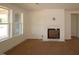 Bright living room featuring a fireplace and large windows offering plenty of natural light at 1104 Opal Ln # 104, Durham, NC 27705