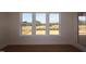 Bright natural light fills the room through a triple window at 1104 Opal Ln # 104, Durham, NC 27705