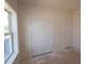 Bright bedroom featuring a closet, a window, and clean, white trim at 1109 Opal Ln # 71, Durham, NC 27705