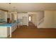 Open kitchen design with a spacious island, white cabinets, and hardwood floors at 1109 Opal Ln # 71, Durham, NC 27705