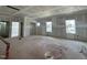 Large, unfinished room with multiple windows, offering great potential for customization at 1109 Opal Ln # 71, Durham, NC 27705