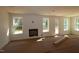 Bright living room with a fireplace, natural light, and easy access to the backyard at 1109 Opal Ln # 71, Durham, NC 27705