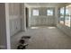 Spacious living room with large windows offering ample natural light; currently under construction at 1109 Opal Ln # 71, Durham, NC 27705