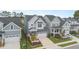 Two-story home with attached garage and landscaping at 1141 Logperch Way, Wendell, NC 27591