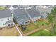 Aerial view showcasing home's backyard, screened porch, and fence at 1141 Logperch Way, Wendell, NC 27591
