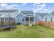 Backyard view showing home's exterior, trampoline, and fence at 1141 Logperch Way, Wendell, NC 27591