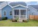 Spacious backyard with screened porch, deck, and well-manicured lawn at 1141 Logperch Way, Wendell, NC 27591