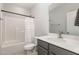 Bathroom with a shower/tub combo, gray vanity, and white countertop at 1141 Logperch Way, Wendell, NC 27591
