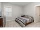 Bedroom with a double bed, dresser, and access to a bathroom at 1141 Logperch Way, Wendell, NC 27591