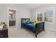 bedroom with a twin bed, colorful bedding, and plenty of toys at 1141 Logperch Way, Wendell, NC 27591