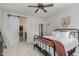 Bedroom with queen bed, barn door to en-suite bathroom, and ceiling fan at 1141 Logperch Way, Wendell, NC 27591