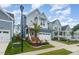 Two-story home with gray siding, white trim, and a charming front porch at 1141 Logperch Way, Wendell, NC 27591
