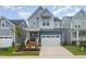 Two-story home with gray siding, white trim, and a charming front porch at 1141 Logperch Way, Wendell, NC 27591