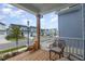 Relaxing front porch with wicker chairs and pumpkins, overlooking the street at 1141 Logperch Way, Wendell, NC 27591
