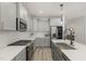 Modern kitchen with gray cabinets, quartz countertops and a farmhouse sink at 1141 Logperch Way, Wendell, NC 27591