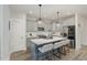 Modern kitchen with gray cabinets, quartz countertops, and stainless steel appliances at 1141 Logperch Way, Wendell, NC 27591